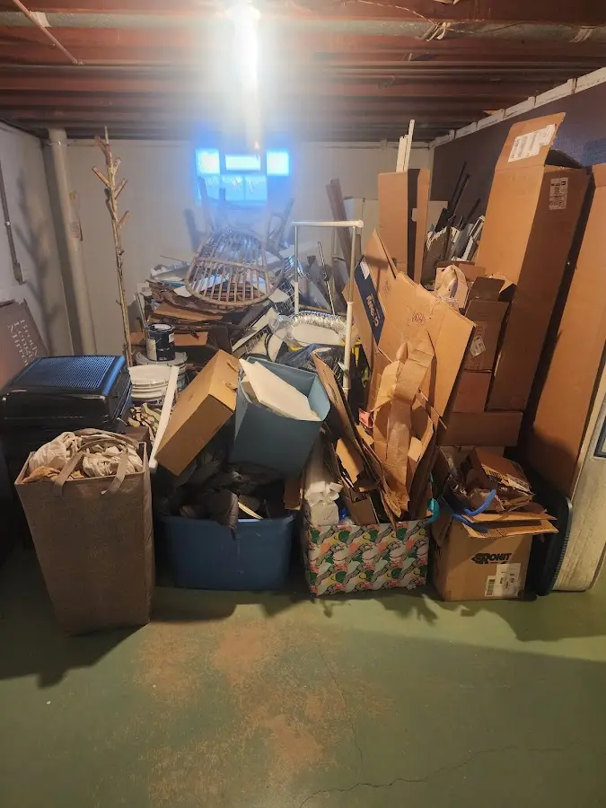 Roll-off dumpster container at job site for 8 Yard Dumpster Rental in Hudson